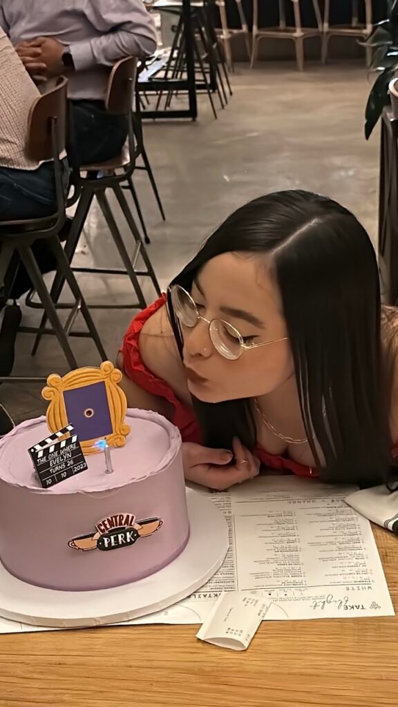 happy client blowing out candles