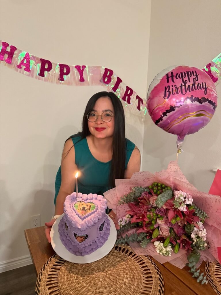 happy client happy at their birthday with their heart printed cake