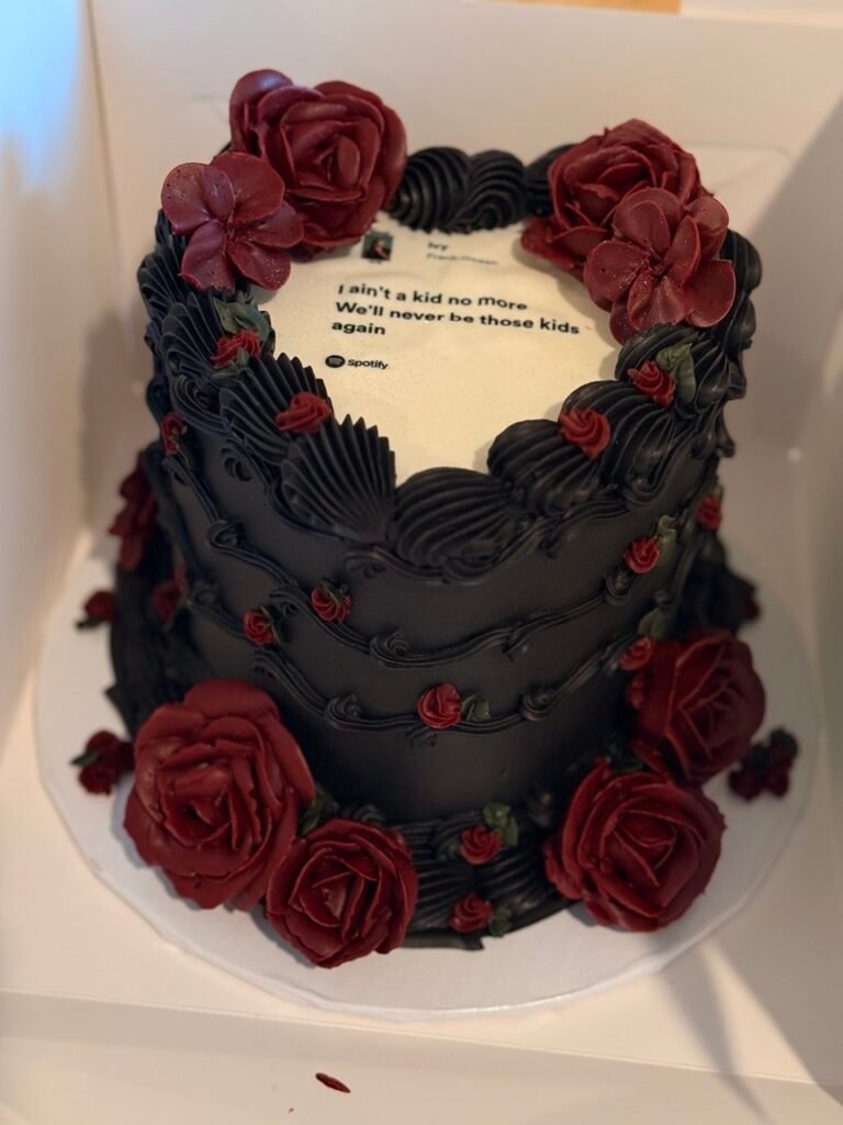 printed heart shaped cake black with red details