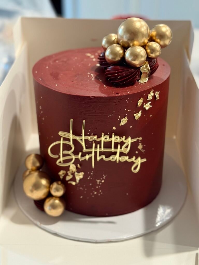 red with gold details dome type cake